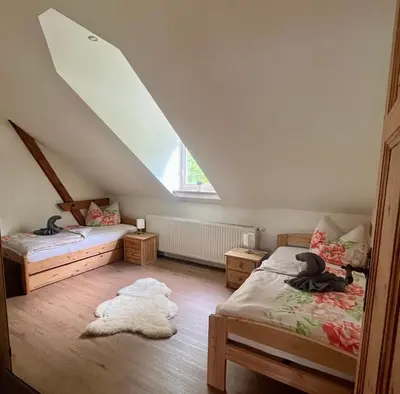 Ein Bett oder Betten in einem Zimmer der Unterkunft Ferienwohnung Bahnsteig 1