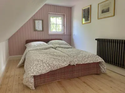 Ein Bett oder Betten in einem Zimmer der Unterkunft Hexenhaus im Jagdhof Carlshaus