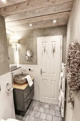 Ein Badezimmer in der Unterkunft HOME Suites Maisonette mit Sauna