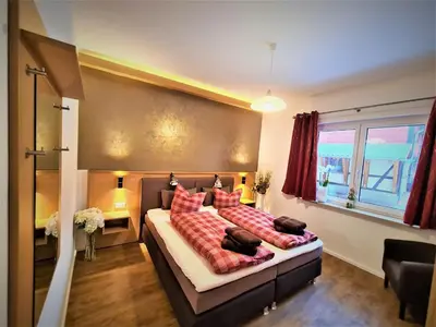 Ein Bett oder Betten in einem Zimmer der Unterkunft Ferienwohnungen Burgfried