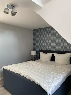 Ein Bett oder Betten in einem Zimmer der Unterkunft Harzzeit Home