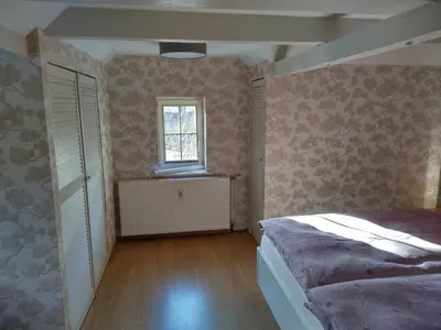 Ein Bett oder Betten in einem Zimmer der Unterkunft Ferienhaus Gero