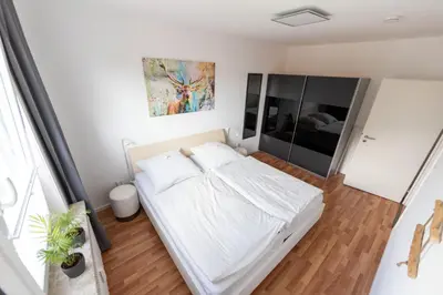 Ein Bett oder Betten in einem Zimmer der Unterkunft Ferienwohnung Martin 3 und 4
