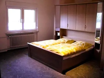Ein Bett oder Betten in einem Zimmer der Unterkunft Ferienwohnung Kroeschell