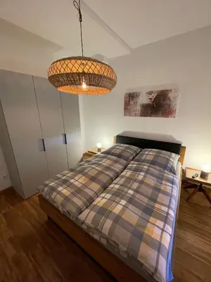 Ein Bett oder Betten in einem Zimmer der Unterkunft Stadtvilla Haug die exklusiven Ferienwohnungen im Harz