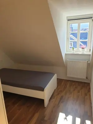 Ein Bett oder Betten in einem Zimmer der Unterkunft Ferienwohnung Leonie