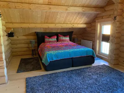 Ein Bett oder Betten in einem Zimmer der Unterkunft Hahnenkleer Hütte Harzliebe