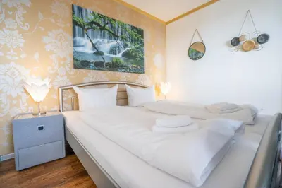 Ein Bett oder Betten in einem Zimmer der Unterkunft Ferienwohnung Kleine Lotusblüte