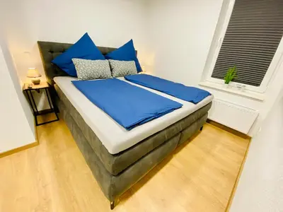 Ein Bett oder Betten in einem Zimmer der Unterkunft FeWo Lebenslust mit Whirlpoolbadewanne #Innenstadt#Außenbereich von Harztraveler