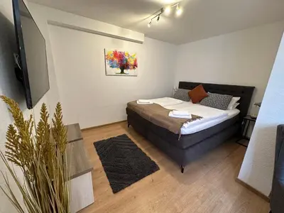Ein Bett oder Betten in einem Zimmer der Unterkunft FeWo Wanderlust #Innenstadt#Außenbereich#ruhige Lage von Harztraveler