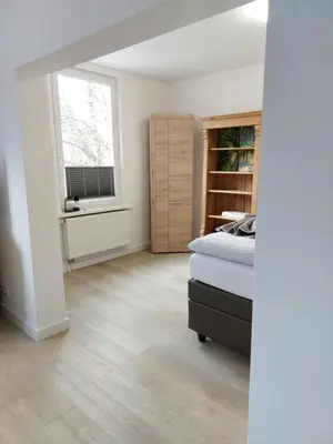 Ein Bett oder Betten in einem Zimmer der Unterkunft Ferienwohnung am Jungbrunnen 2