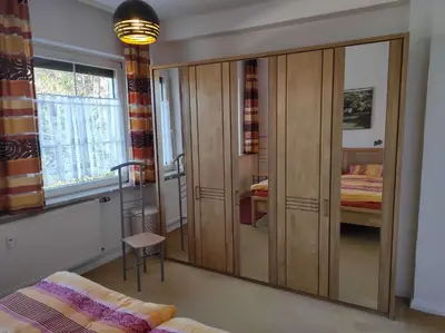 Ein Bett oder Betten in einem Zimmer der Unterkunft Ferienwohnung Villa Specht