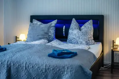 Ein Bett oder Betten in einem Zimmer der Unterkunft Ferienhaus Peggy mit Klimaanlage in den Bergen