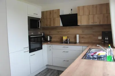 Küche/Küchenzeile in der Unterkunft REGIOHOTEL Aparthotel Wernigerode - #Ferienwohnungen #Familienfreundlich #Harzurlaub #Freeparking