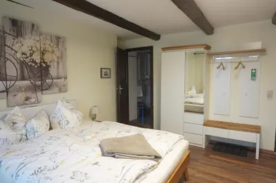 Ein Bett oder Betten in einem Zimmer der Unterkunft Pension Zum Lukullus