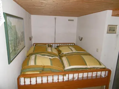 Ein Bett oder Betten in einem Zimmer der Unterkunft Gartenwohnung Bodetalblick