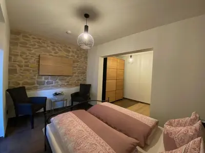 Ein Bett oder Betten in einem Zimmer der Unterkunft Ferienwohnung Heideviertel