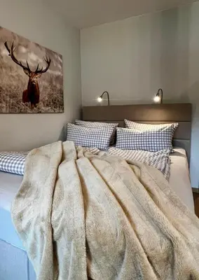 Ein Bett oder Betten in einem Zimmer der Unterkunft The Lodge Braunlage