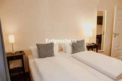 Ein Bett oder Betten in einem Zimmer der Unterkunft Alte Münze Apartments