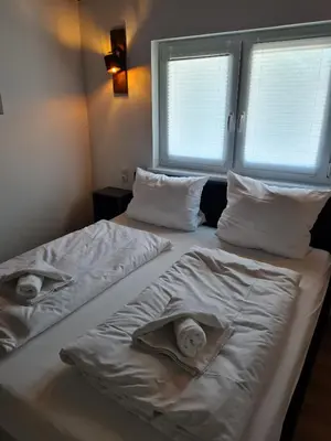Ein Bett oder Betten in einem Zimmer der Unterkunft Haus DeMa
