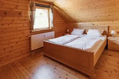 Ein Bett oder Betten in einem Zimmer der Unterkunft Naturerlebnisdorf Blauvogel im Harz