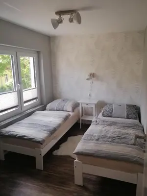 Ein Bett oder Betten in einem Zimmer der Unterkunft Ferienwohnung Am Stadtwald