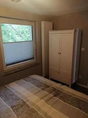 Ein Bett oder Betten in einem Zimmer der Unterkunft Ferienwohnung Am Stadtwald