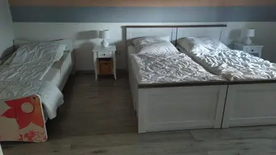 Ein Bett oder Betten in einem Zimmer der Unterkunft FeWo unter den Eichen