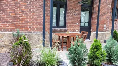 Ein Garten an der Unterkunft Bahnhof Gleis 72 - Ferienwohnungen