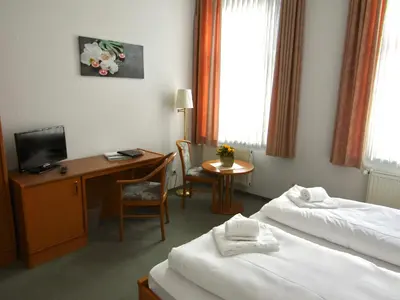 Ein Bett oder Betten in einem Zimmer der Unterkunft Pension Hexenkessel