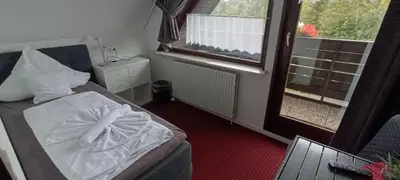 Ein Bett oder Betten in einem Zimmer der Unterkunft Quellenhof Altenau