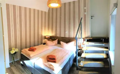 Ein Bett oder Betten in einem Zimmer der Unterkunft Ferienhaus Burgfried