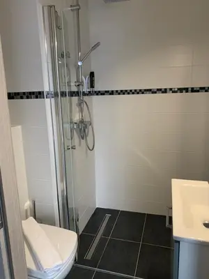 Ein Badezimmer in der Unterkunft Hotel Paidion