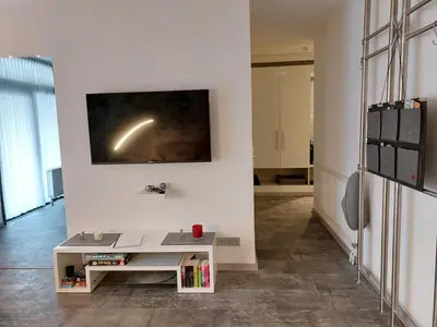 TV/Unterhaltungsangebot in der Unterkunft Ferienwohnung Domicile chic mit Schwimmbad und Saunanutzung