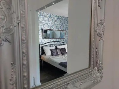 Ein Bett oder Betten in einem Zimmer der Unterkunft Ferienwohnung Domicile chic mit Schwimmbad und Saunanutzung