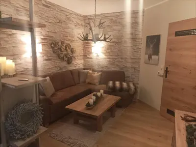 Ein Sitzbereich in der Unterkunft Harzglanz FeWo's KuschelBude