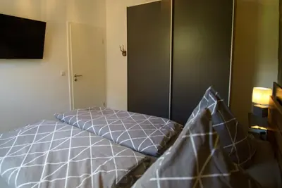 Ein Bett oder Betten in einem Zimmer der Unterkunft Ferienwohnung Busch 1