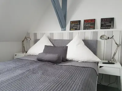 Ein Bett oder Betten in einem Zimmer der Unterkunft Schöne Ferienwohnung für 6 Personen erwartet Sie im Oberharz