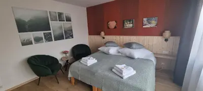 Ein Bett oder Betten in einem Zimmer der Unterkunft Orchidee Altenau