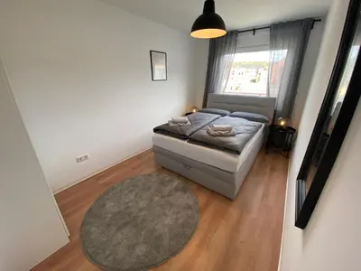 Ein Bett oder Betten in einem Zimmer der Unterkunft Apartments-Badharzburg / Ferienwohnung im Zentrum