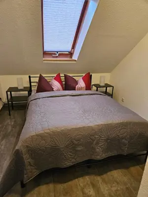 Ein Bett oder Betten in einem Zimmer der Unterkunft Mittel-Schänke Wieda