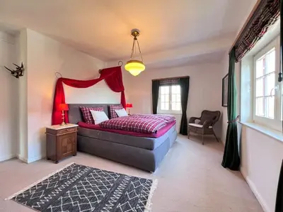 Ein Bett oder Betten in einem Zimmer der Unterkunft Villa Herzog - Ferienhaus für 6 Personen in Braunlage, Harz