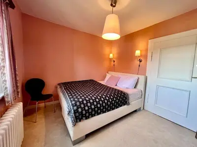 Ein Bett oder Betten in einem Zimmer der Unterkunft Villa Herzog - Ferienhaus für 6 Personen in Braunlage, Harz