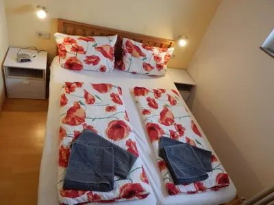 Ein Bett oder Betten in einem Zimmer der Unterkunft Apartement zur Bergoase mit Schwimmbad für Groß und Klein