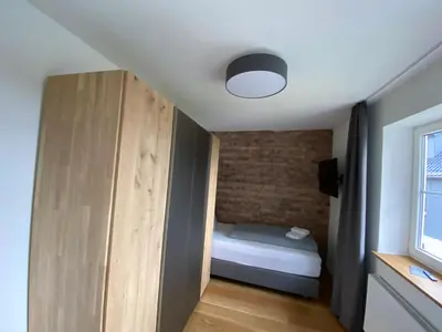 Ein Bett oder Betten in einem Zimmer der Unterkunft BERGLAGE - Das UrlaubZuhause - Ferienhäuser
