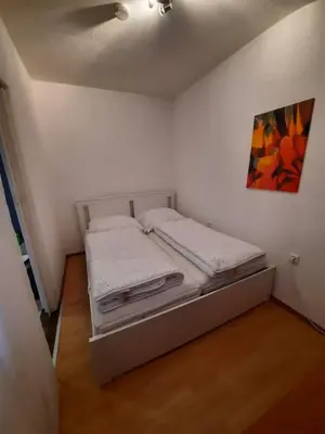 Ein Bett oder Betten in einem Zimmer der Unterkunft Gipfelstürmer