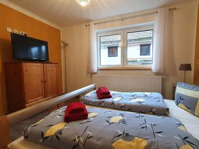 Ein Bett oder Betten in einem Zimmer der Unterkunft Kleine Bergstraße 2 - Haus 1