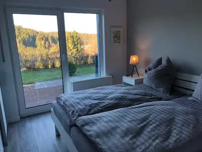 Ein Bett oder Betten in einem Zimmer der Unterkunft Ferienwohnung 