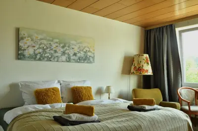 Ein Bett oder Betten in einem Zimmer der Unterkunft Braunlage Vintage Quartier - Haus bis 16 Personen - 8 Zimmer WG