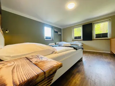 Ein Bett oder Betten in einem Zimmer der Unterkunft Haus am Bach